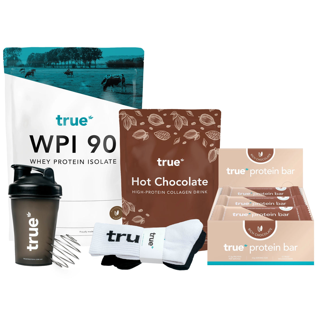 True protein starter bundle: True WPI 90 whey protein isolate bag, True Hot Chocolate high‑protein collagen drink pouch, box of True protein bars (Rich Chocolate), black True shaker bottle with mixing whisk and branded socks on white background